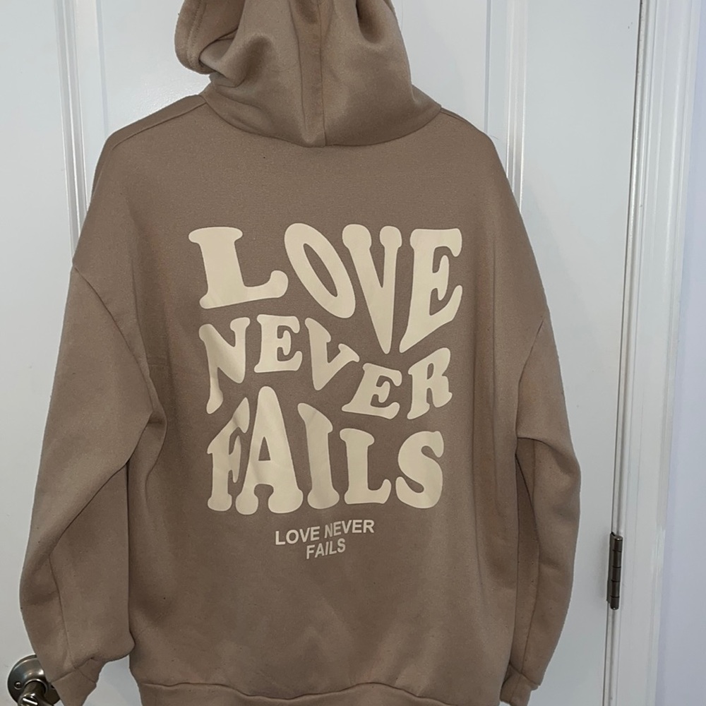 “Love Never Fails” Hoodie